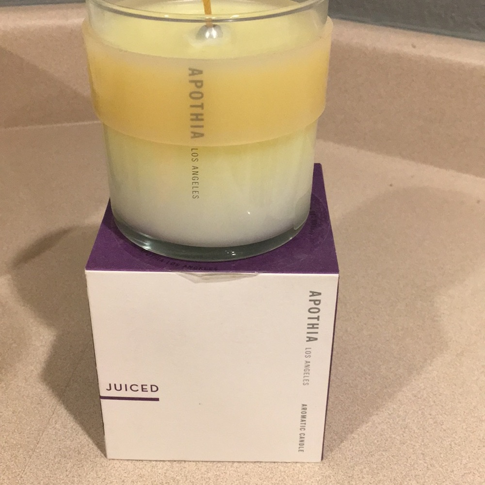 Apothia juiced 9 oz candle.